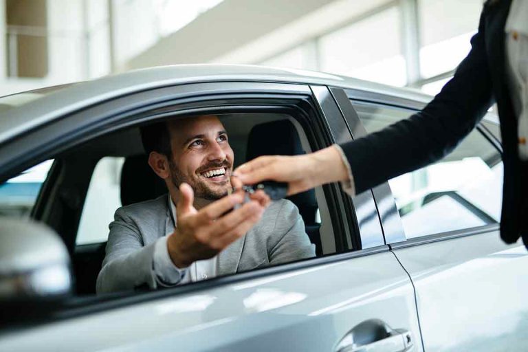 cropped-portrait-of-happy-customer-buying-new-car-RYEWB4F-768x512-1.jpg